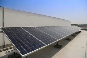 10 kW rooftop solar panel system installed on a commercial building in India showcasing on-grid solar power generation
